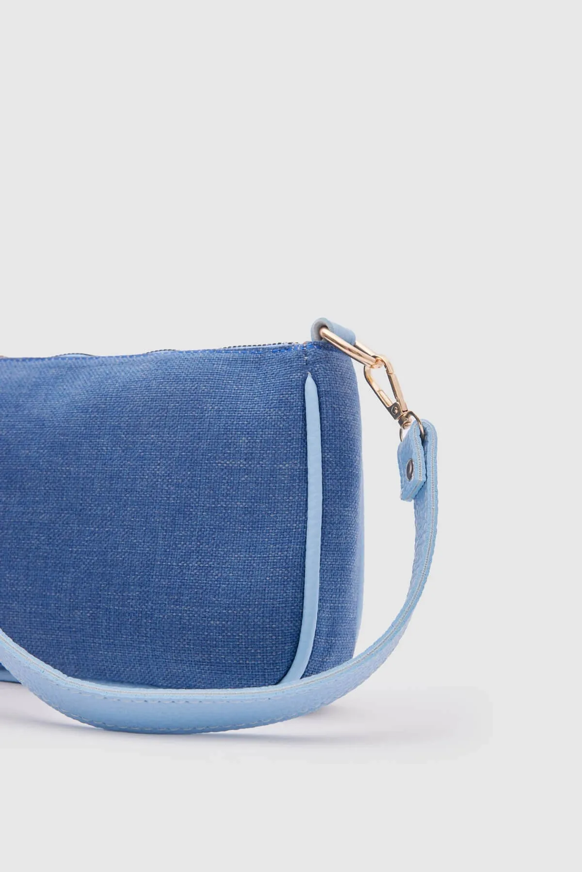 Kate Denim Buckled Denim Baguette Bag