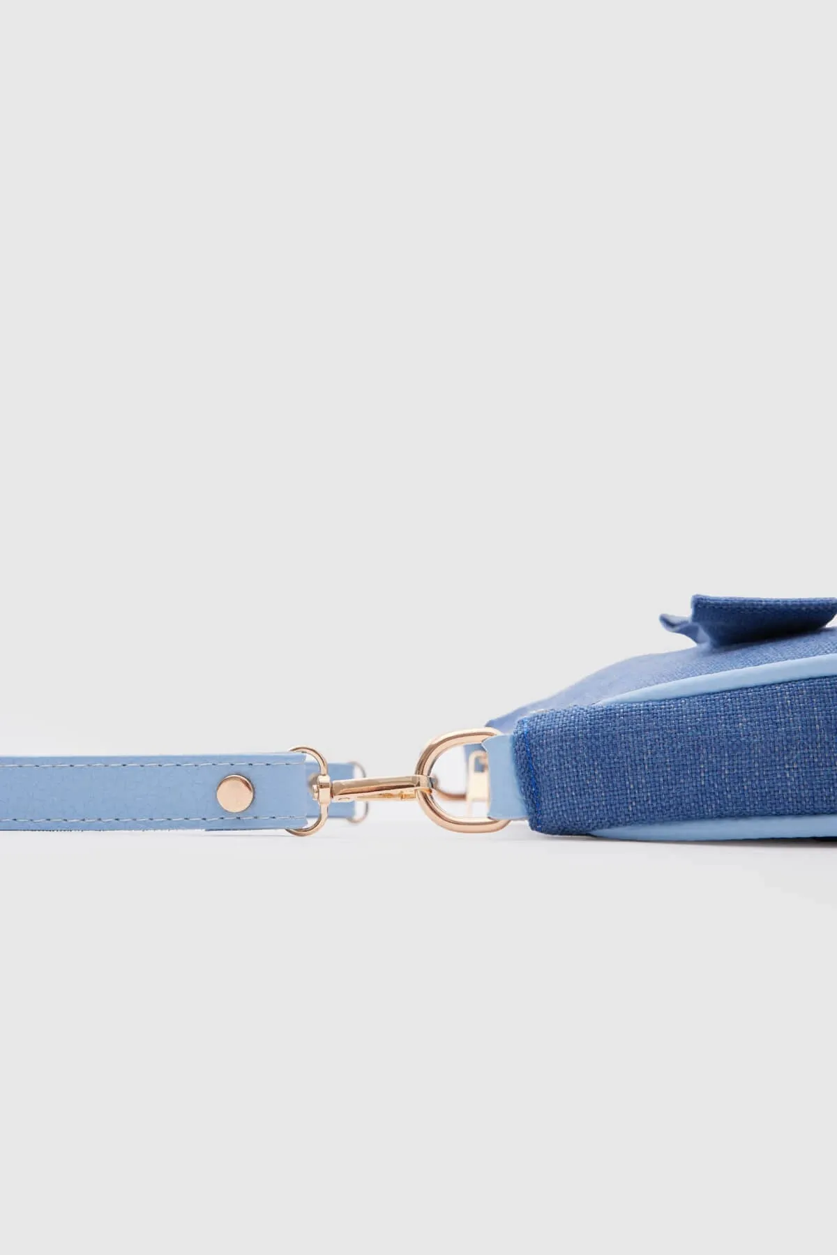 Kate Denim Buckled Denim Baguette Bag