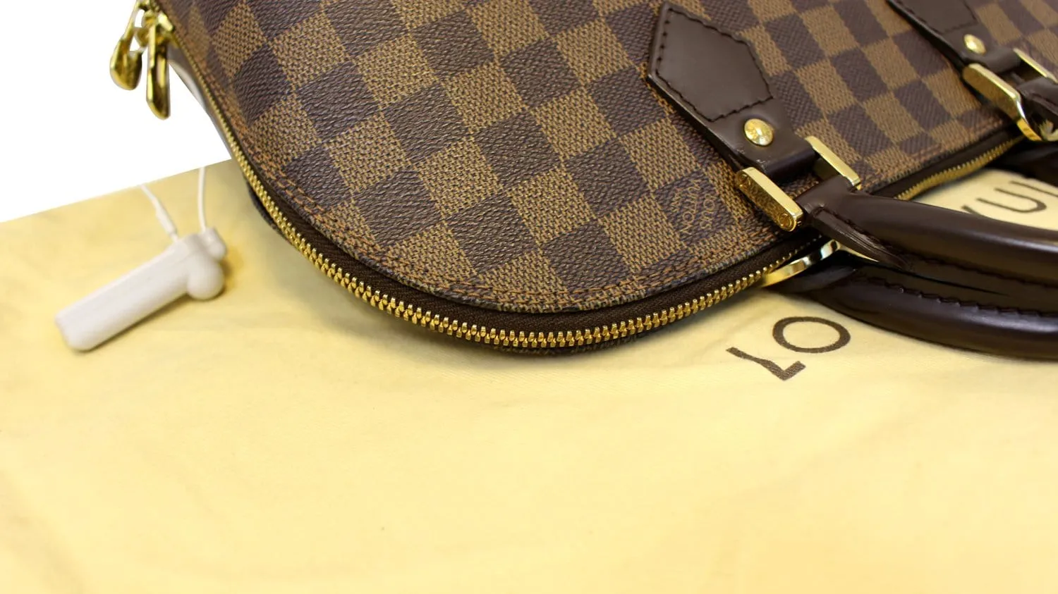 LOUIS VUITTON Damier Ebene Alma Brown Handbag