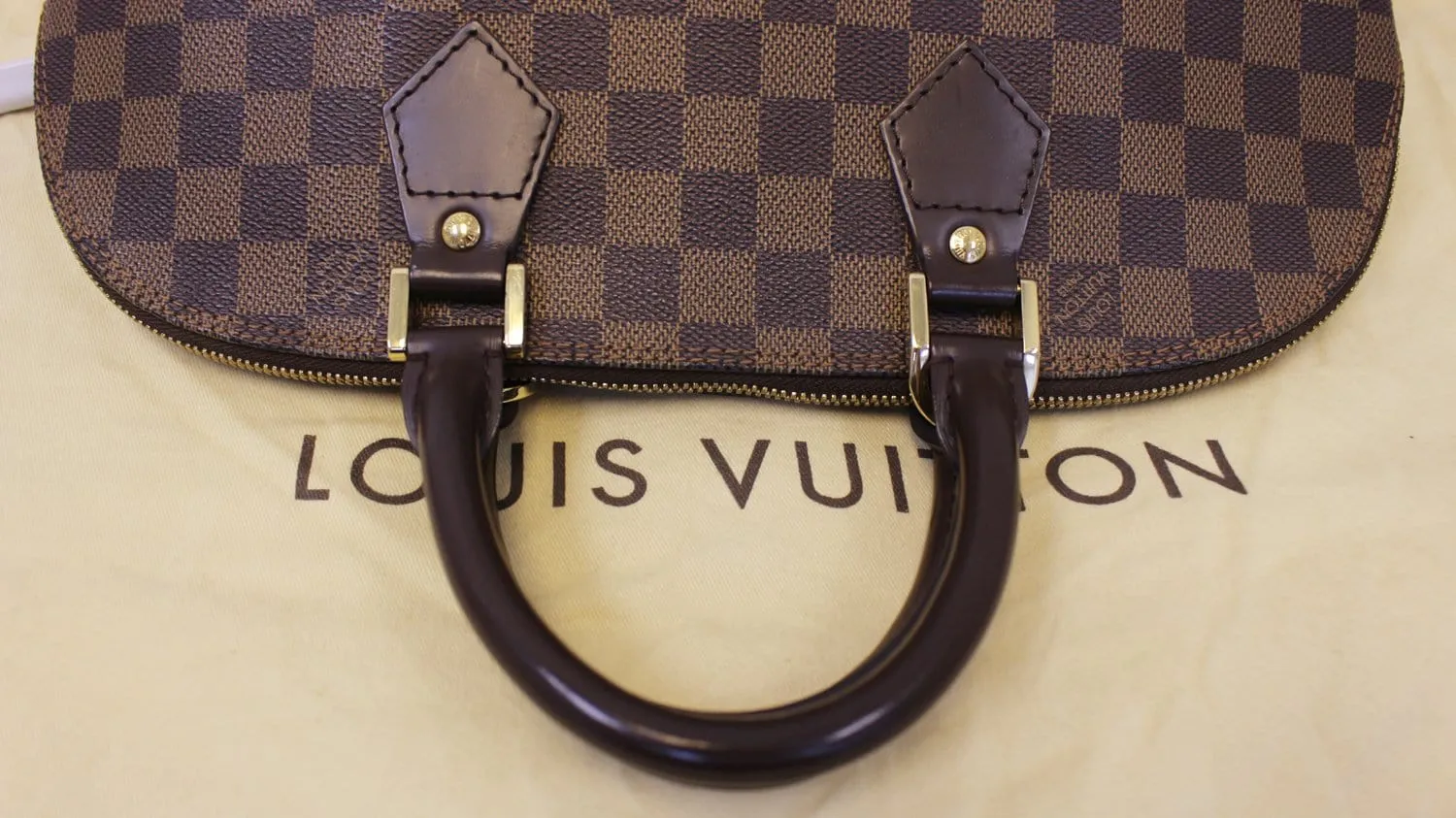 LOUIS VUITTON Damier Ebene Alma Brown Handbag