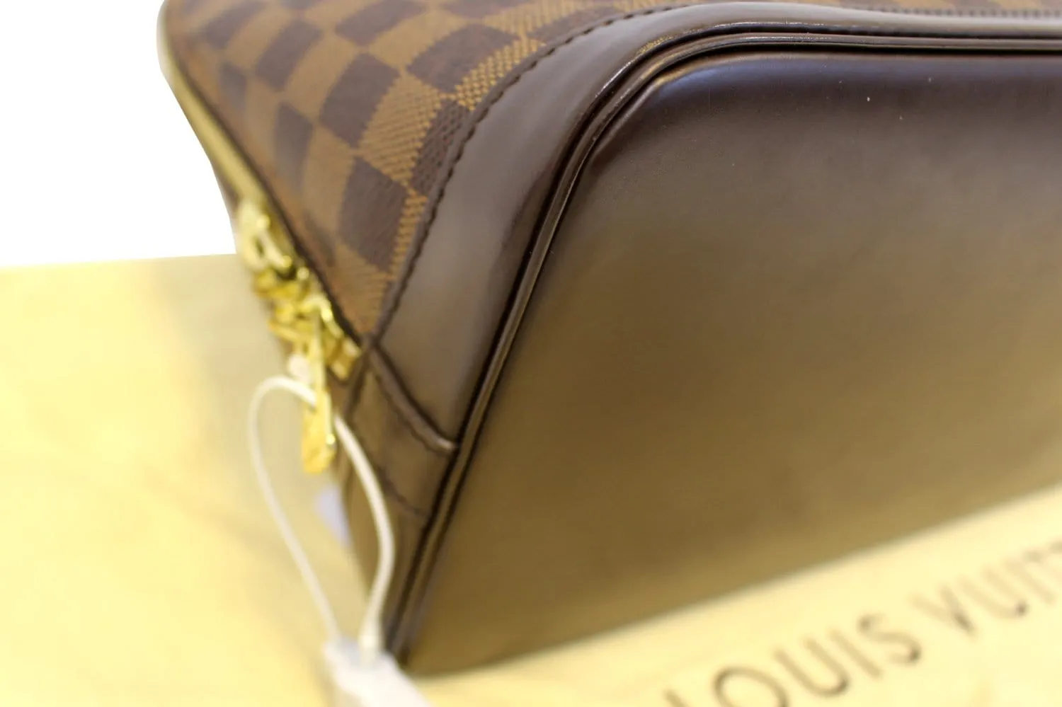 LOUIS VUITTON Damier Ebene Alma Brown Handbag