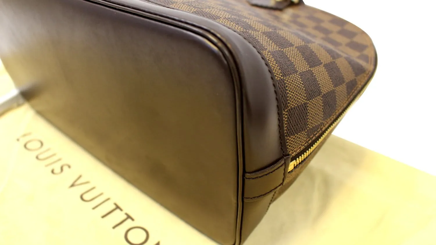 LOUIS VUITTON Damier Ebene Alma Brown Handbag