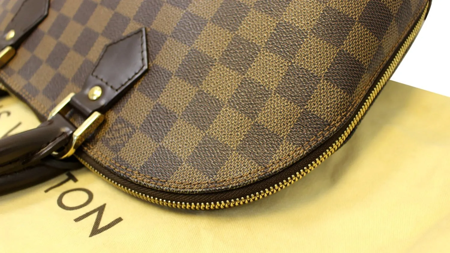 LOUIS VUITTON Damier Ebene Alma Brown Handbag