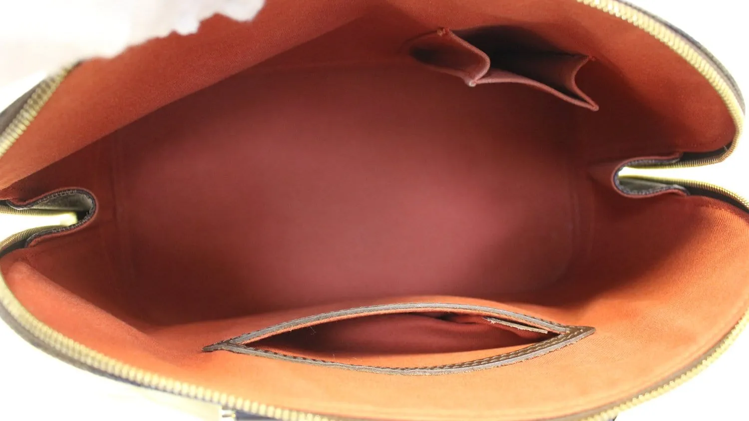 LOUIS VUITTON Damier Ebene Alma Brown Handbag