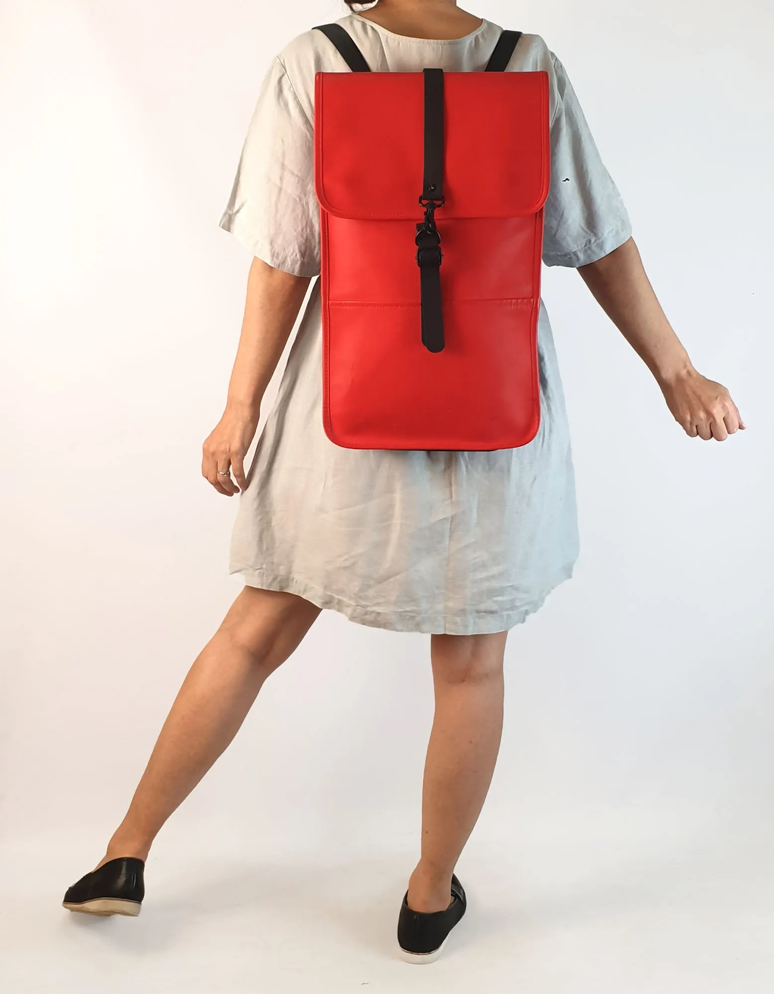 Rains large red rucksack / backpack with black straps and detail