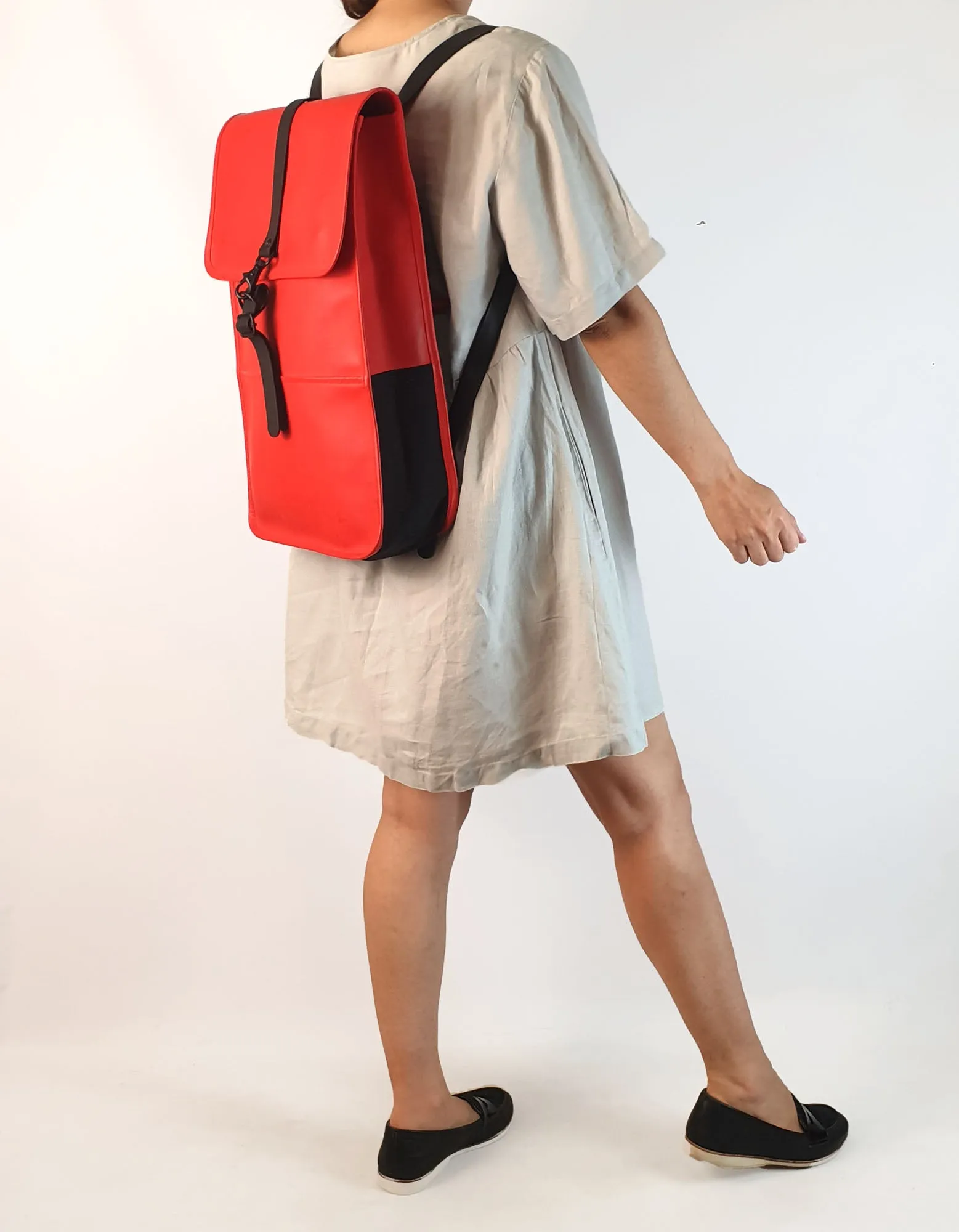 Rains large red rucksack / backpack with black straps and detail