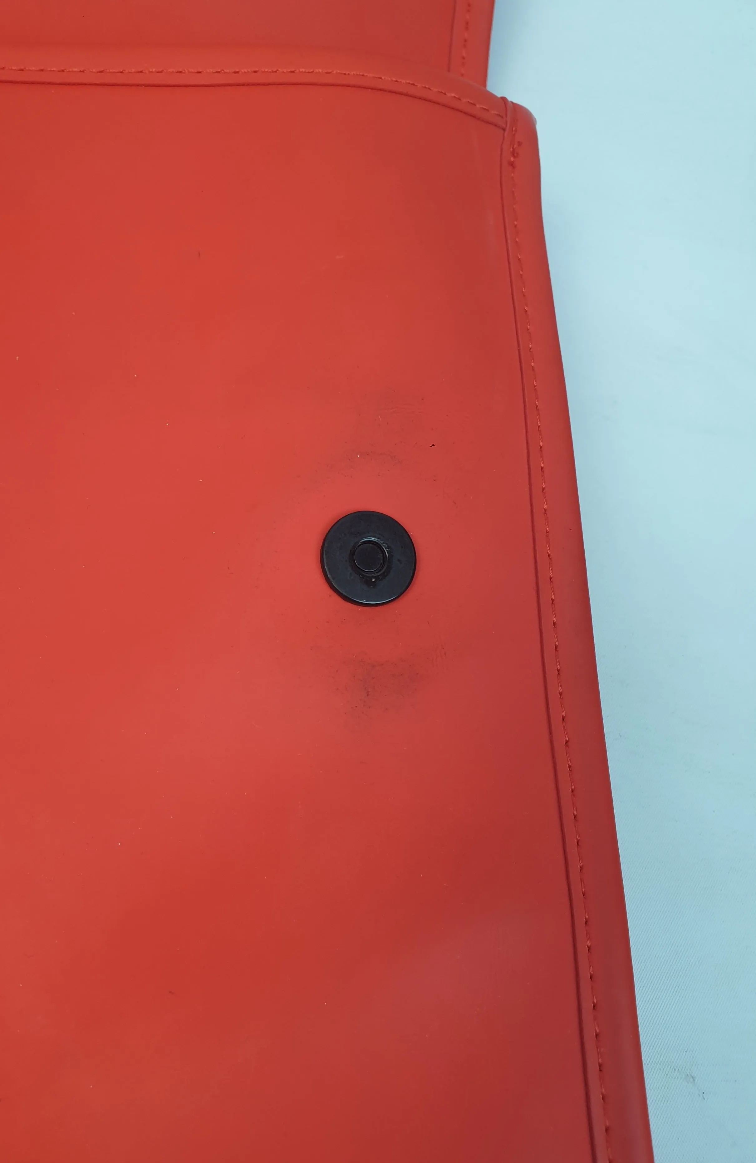 Rains large red rucksack / backpack with black straps and detail